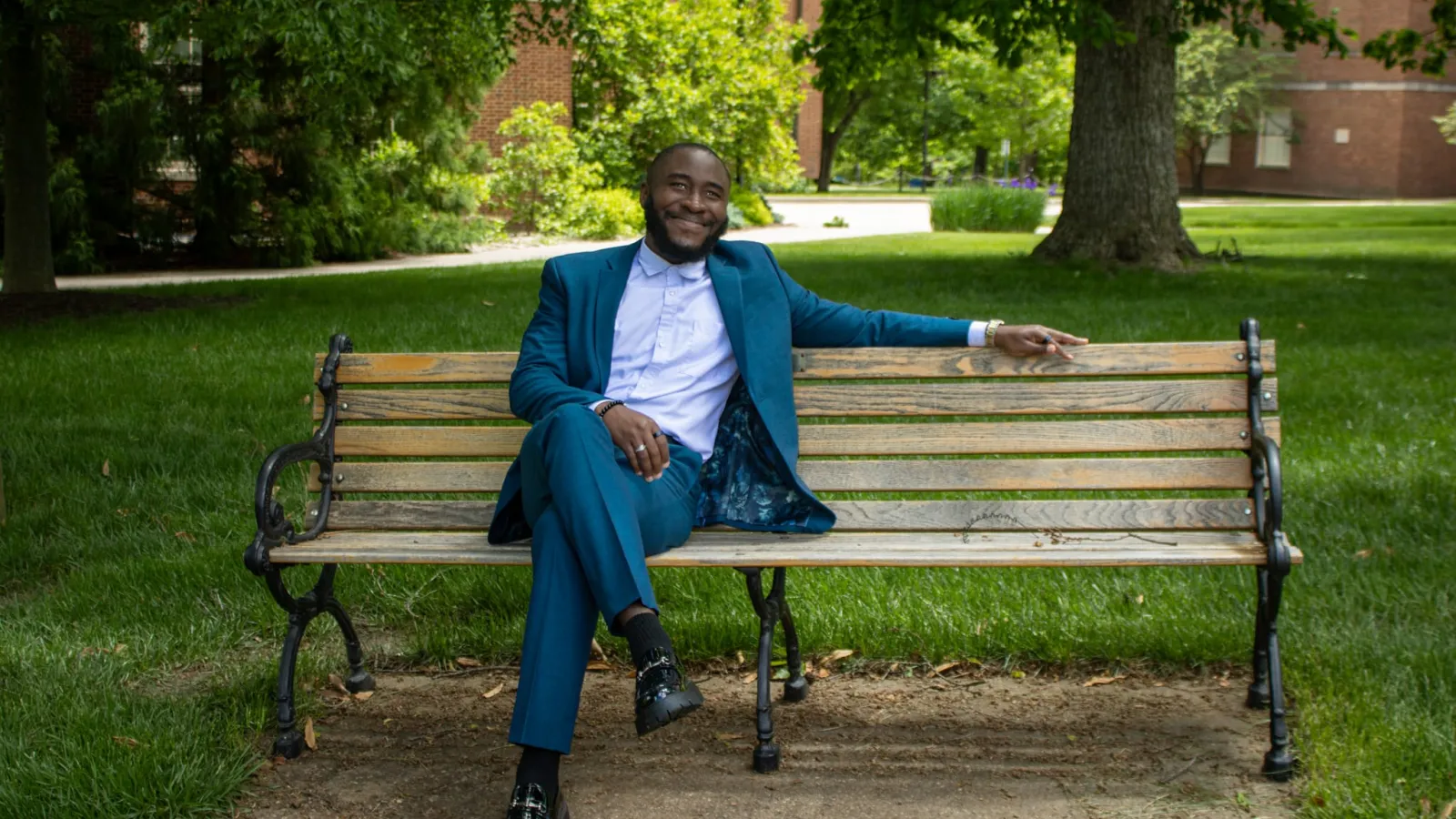 Michael Okanta sitting on a bench