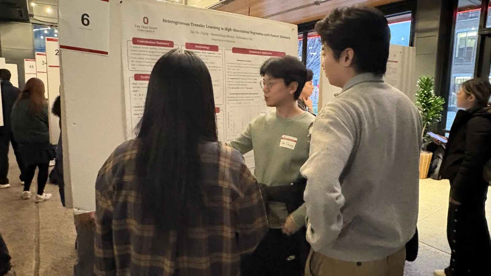Students in front of presenter going over project board